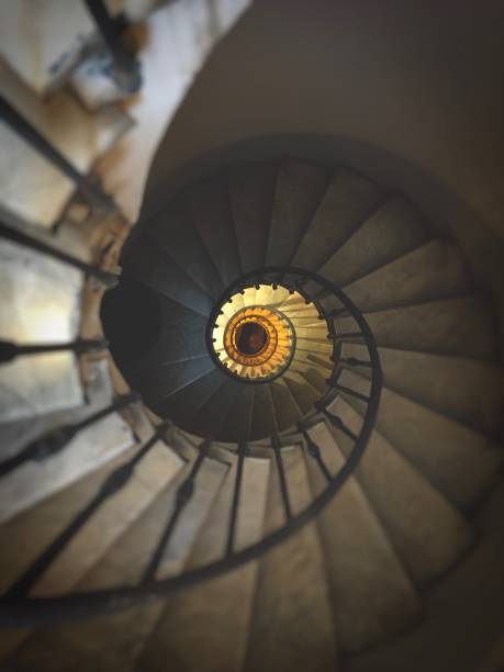 istock ancient spiral staircase with wrought iron handrail and marble steps 1089764004