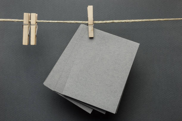 istock Blank greeting card on the rope over black background 1089764300