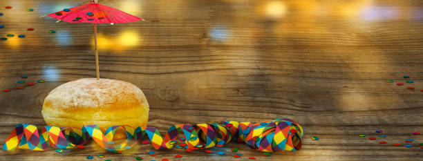 istock berliner donut for carnival decoration on wooden background 1089764376