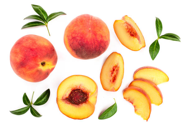 istock ripe peaches with leaves isolated on white background. Top view. Flat lay pattern 1089768818