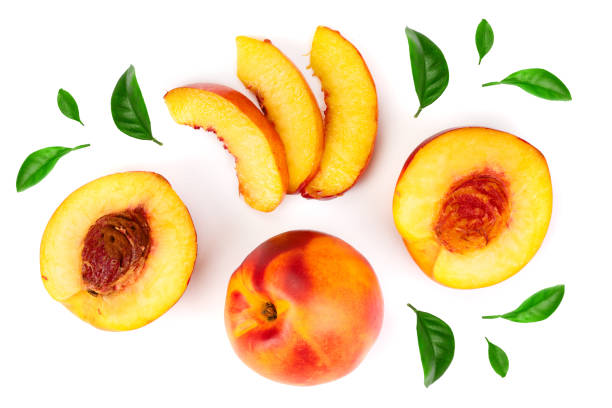 istock ripe nectarine with leaves isolated on white background. Top view. Flat lay pattern 1089768836