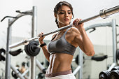 Woman training with weight