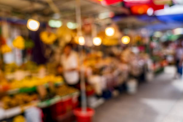Blurred background, people shopping at market