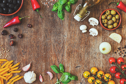 Stylish composition of fresh, italian ingredients and food on the vintage wooden table. Culinary backgrounds