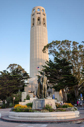 San Francisco, California - August 21, 2018: Coit Tower at sunset, a popular landmark in the city. Portrait view orientation. Clear sunny skies