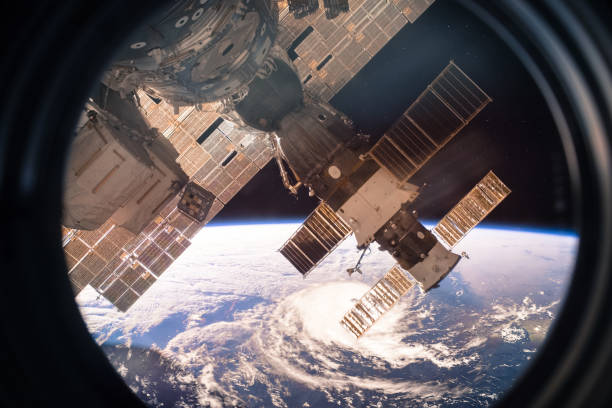 Collage image with planet Earth from the outer space from the ISS window. Huge hurricane. Elements of this image furnished by NASA.