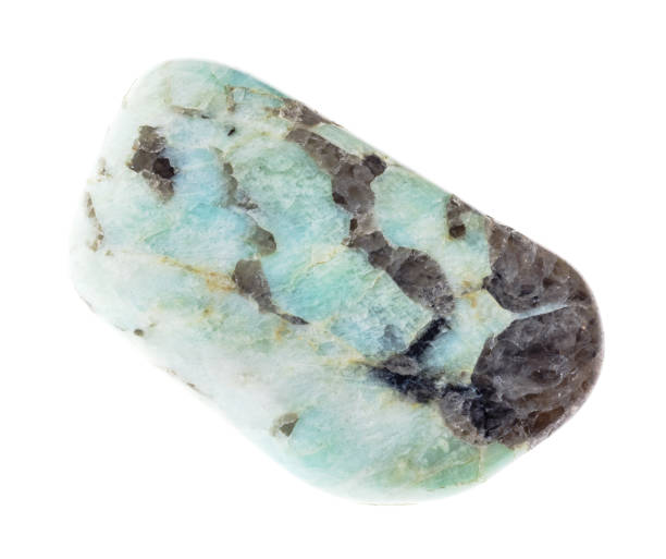 istock polished green Pegmatite stone on white 1089783878
