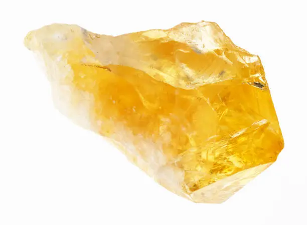 macro photography of natural mineral from geological collection - raw crystal of Citrine (yellow quartz) on white background
