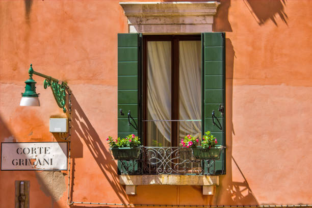 Windows on the old building in Venice canal, Italy