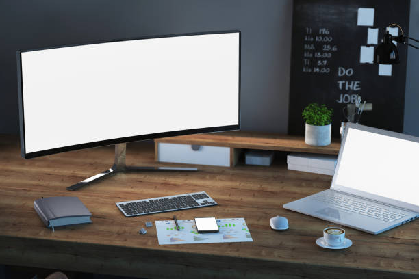 istock Office desk scenery with computer and laptop with blank screen mock-up 1089797804