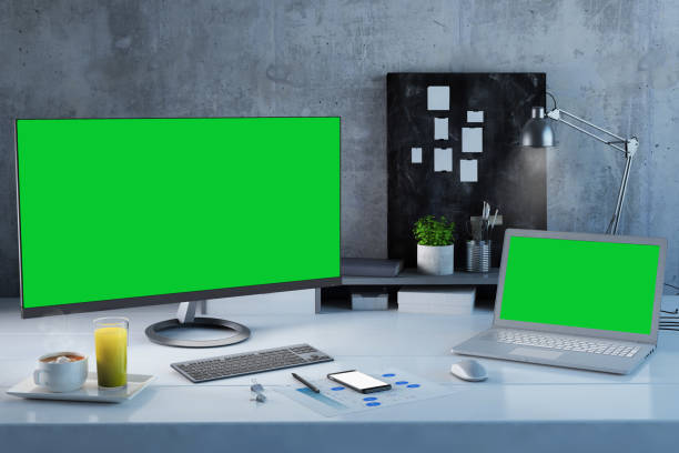 istock Office desk scenery with computer and laptop with blank screen mock-up 1089797818