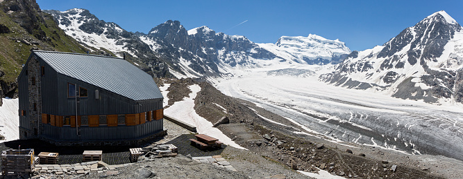 Mountain refuge Panossière with on the background Glacier de Corbassière and mountain Grand Combin (Fionnay, Switzerland)