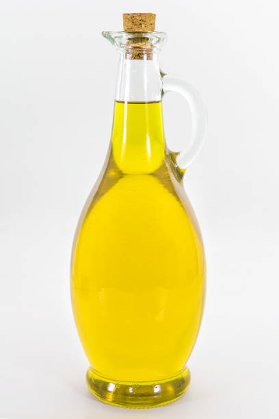istock olive oil in bottle isolated on white background. 1089803958