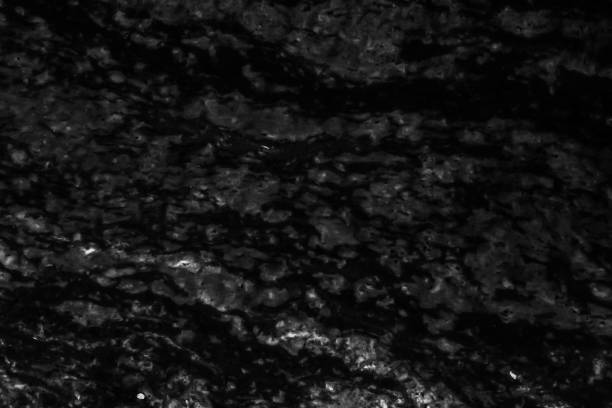 Computer generated contemporary wall lit by streams of sunlight and a slight wet sheen on floor. High contrast between lit and unlit.