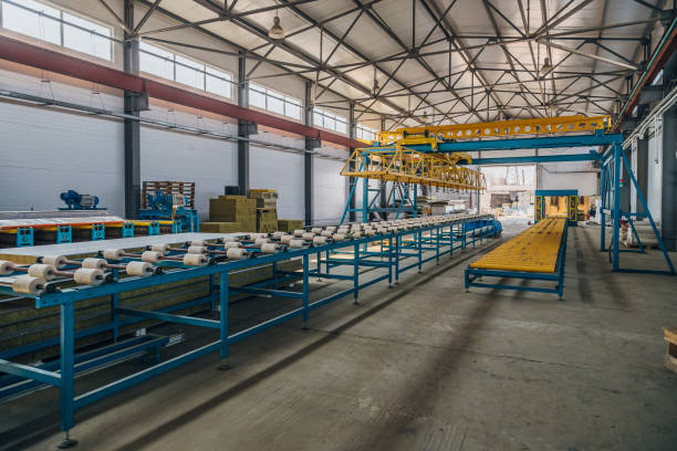 istock Insulation sandwich panel production line. Machine tools, roller conveyor and gantry crane in workshop 1089810292