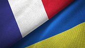 Ukraine and France two flags together realations textile cloth fabric texture