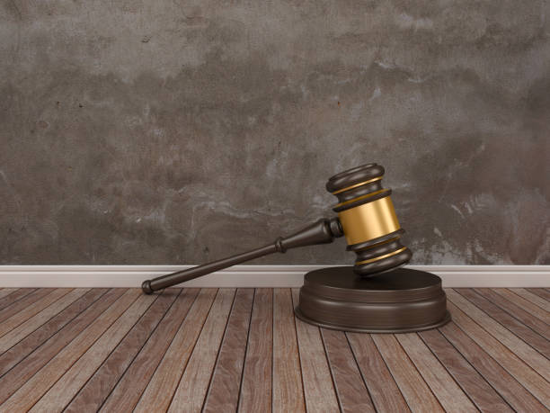 istock Gavel on Wood Floor - 3D Rendering 1089810904