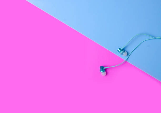 istock Headphones on color pink blue background 1089815372