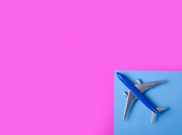 istock Blue model plane,airplane on color pink blue background 1089815580