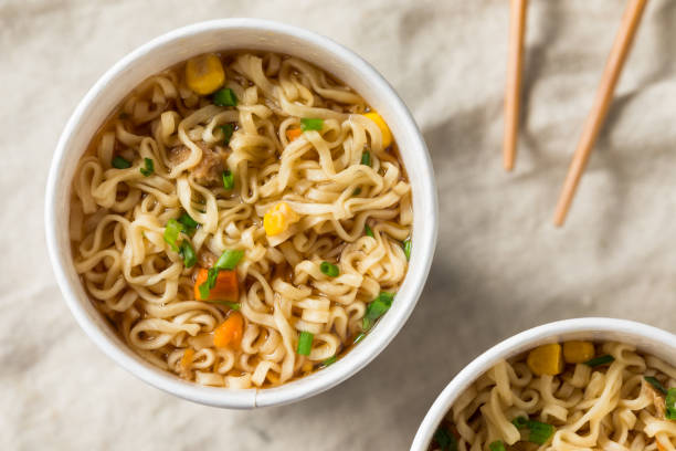 Instant Ramen Noodles in a Cup Instant Ramen Noodles in a Cup with Beef Flavoring chopsticks photos stock pictures, royalty-free photos & images