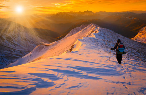istock A man in mountain sunset winter. Unique. Christmas 1089817584