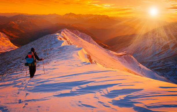 istock A man in mountain sunset winter. Unique. Christmas 1089817606