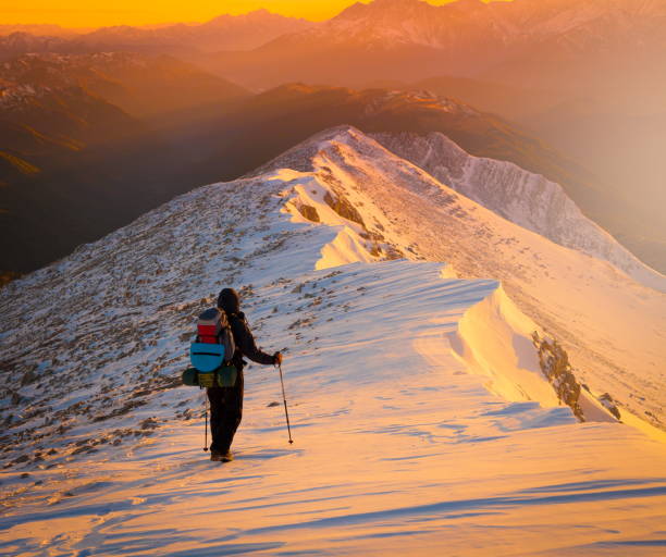 istock A man in mountain sunset winter. Unique. Christmas 1089817634