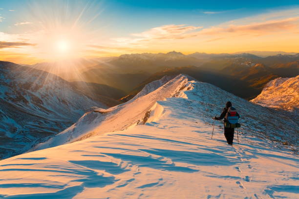 istock A man in mountain sunset winter. Unique. Christmas 1089818894