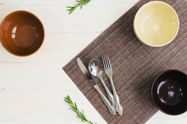 istock Set of bowls with fork, spoon and knife. Written breakfats, lunch, dinner on ceramic bowls.Selective focus. Copy space. 1089827852