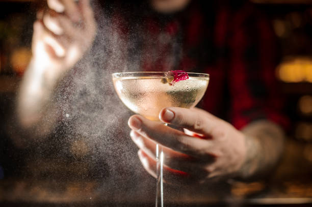 istock Mixologist splashing bitter on the elegant cocktail glass 1089829868