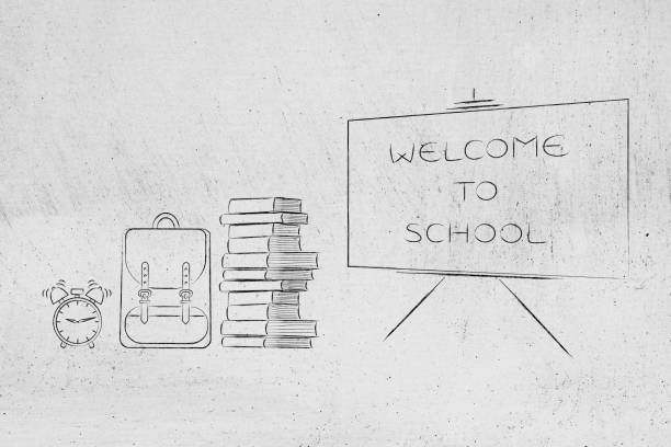 istock Welcome to school blackboard next to textbooks backpack and alarm 1089831620