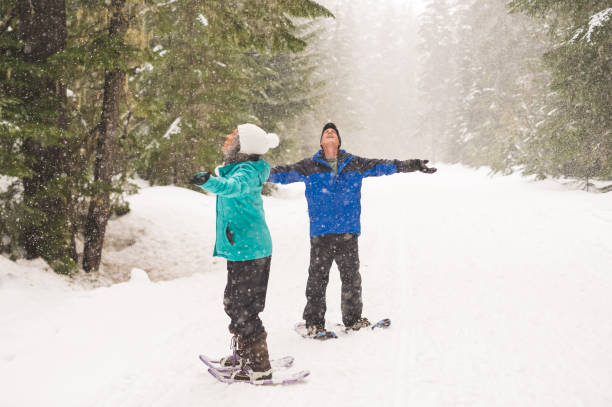 istock A senior couple snowshoeing in the forest 1089832182