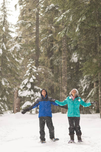 istock A senior couple snowshoeing in the forest 1089832188