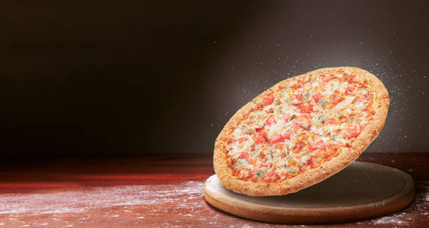 istock classic pizza on a dark wooden table 1089834728