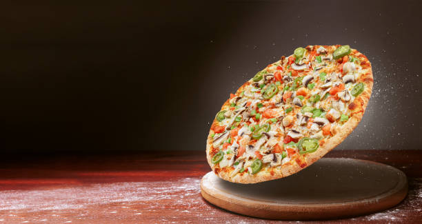 istock classic pizza on a dark wooden table 1089834844