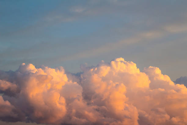 istock big orange cumulus clouds at sunset 1089846306