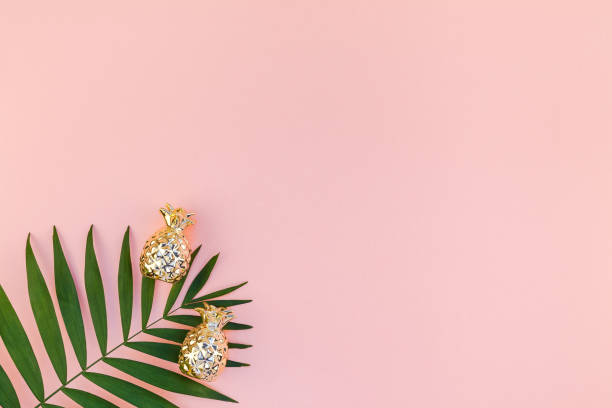 istock Creative pink background with tropical palm leaves 1089846442