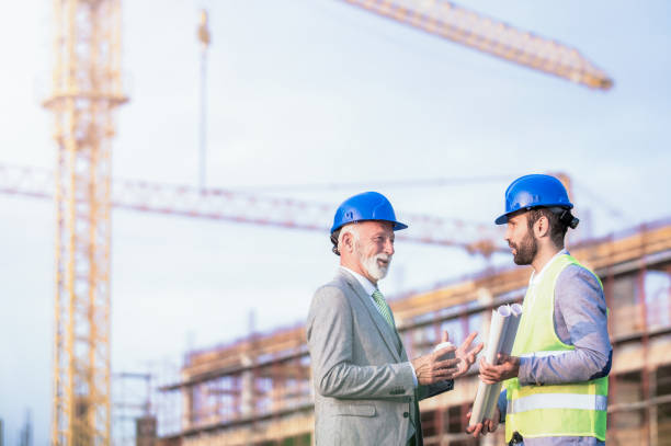 istock Senior investor and mid adult architect on a construction site. 1089848694