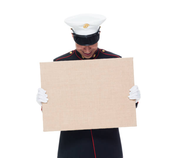 istock US Marine in uniform holding placard 1089849638