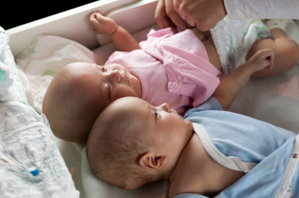 istock Young dad changes the diaper and clothes to his newborn small child. Selective focus. 1089852064