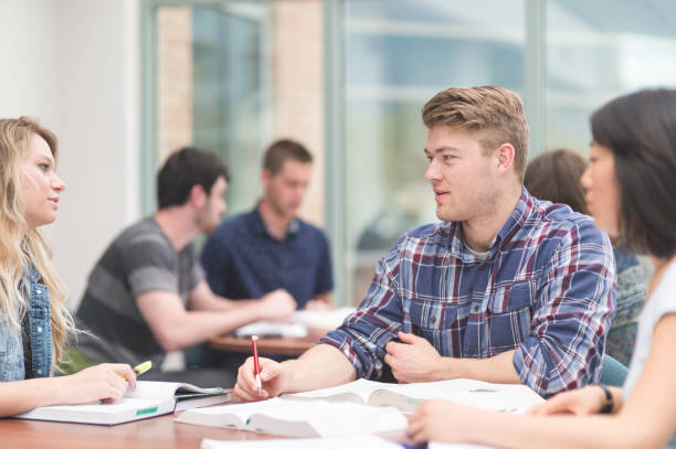 istock College students working on an assignment together in the library 1089853044