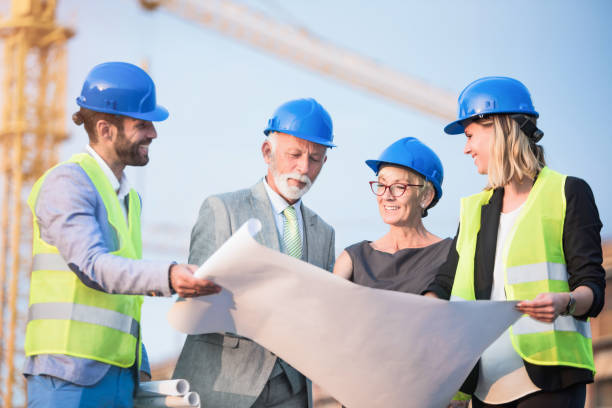 istock Investors and architects on a construction site. 1089855076