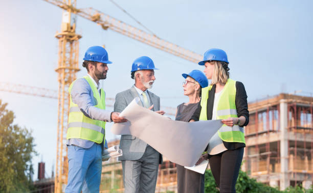 istock Investors and architects on a construction site. 1089855618