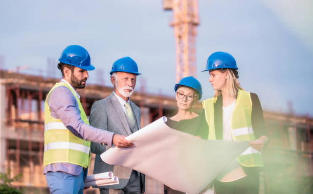 istock Investors and architects on a construction site. 1089859520