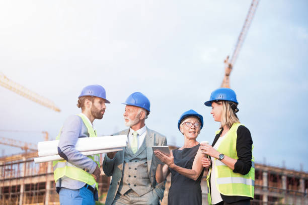istock Investors and architects on a construction site. 1089859940