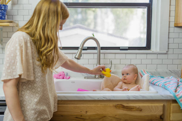 istock Bath time in the kitchen sink 1089860078