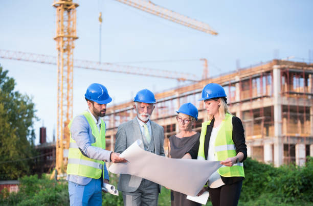 istock Investors and architects on a construction site. 1089861064