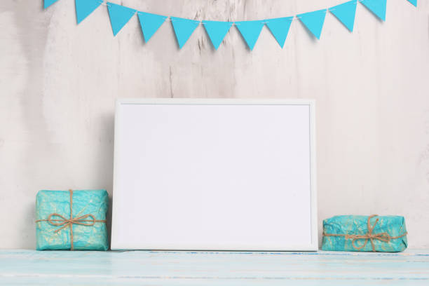 istock Festive mood, children's garland with a white empty frame for design, and toys with gift layout. Baby shower 1089863928