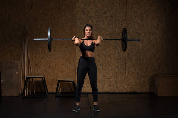 istock Woman performs deadlift with weight at the gym 1089867918
