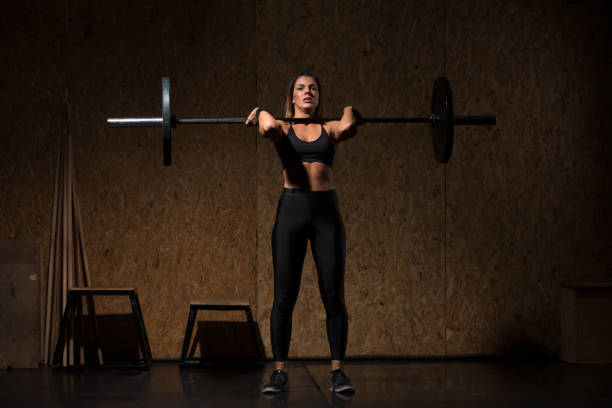 istock Woman performs deadlift with weight at the gym 1089867928